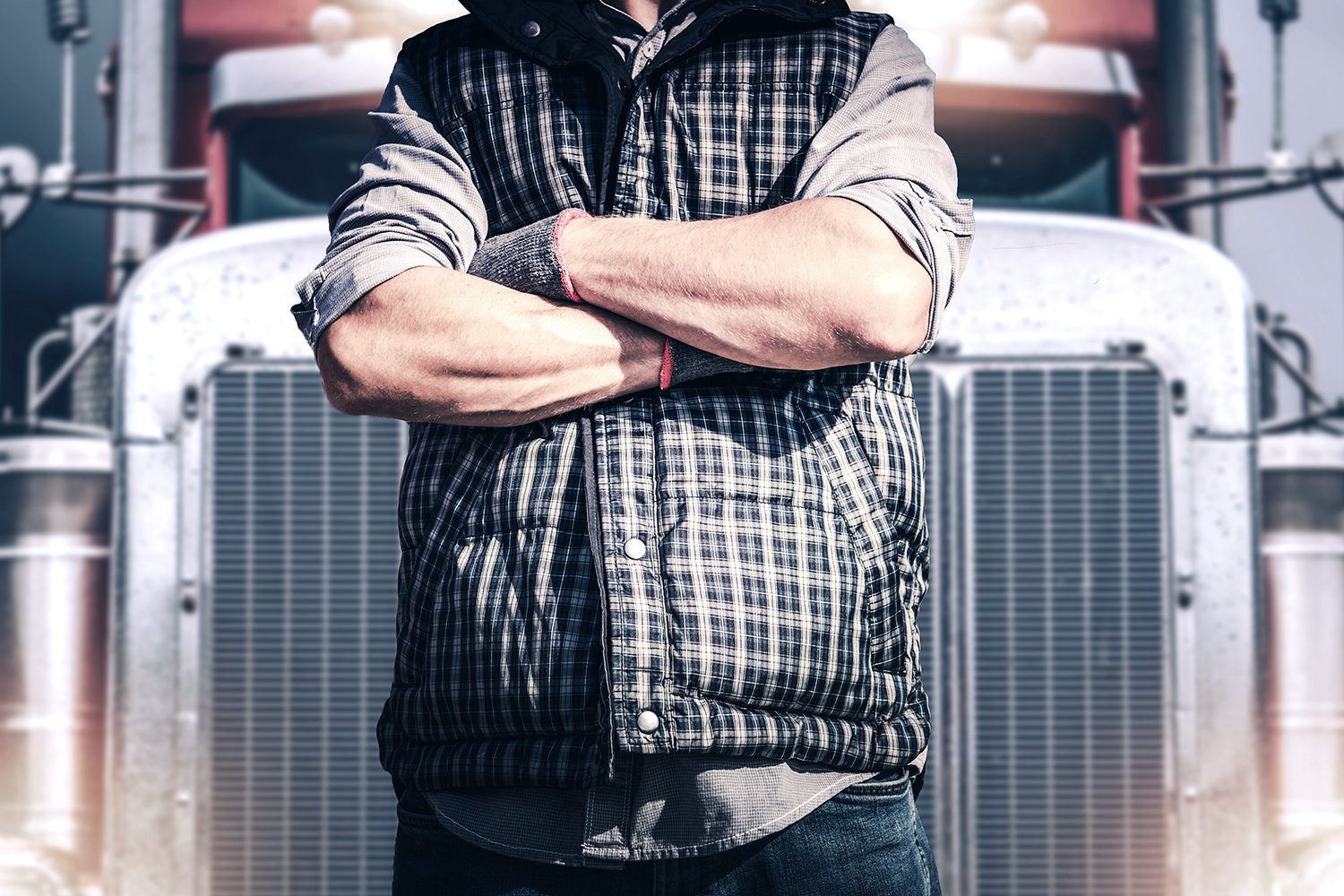 Truck driver in front of semi-truck